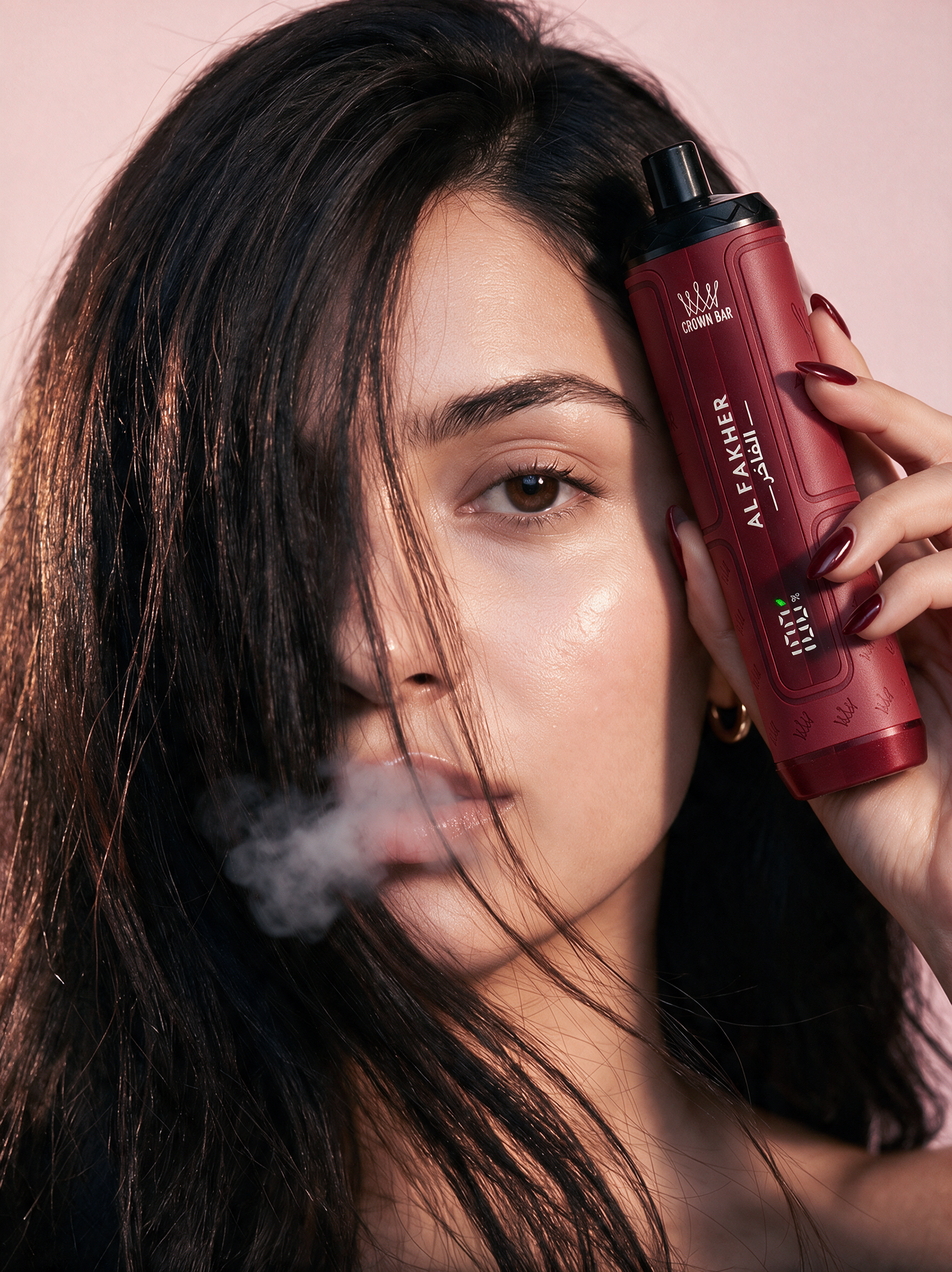 Al Fakher campaign portrait with a model holding a red product